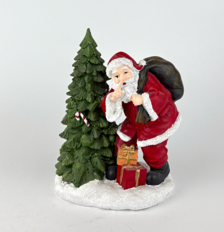 Santa Leaning Against Tree
