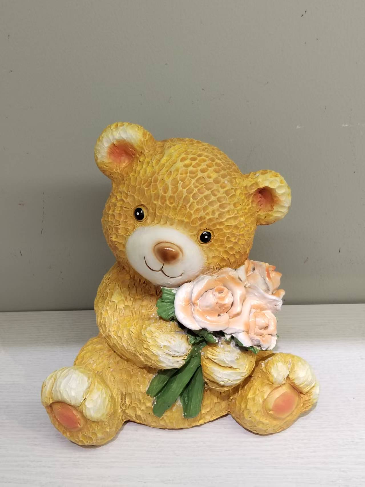 Bear Holding Flowers